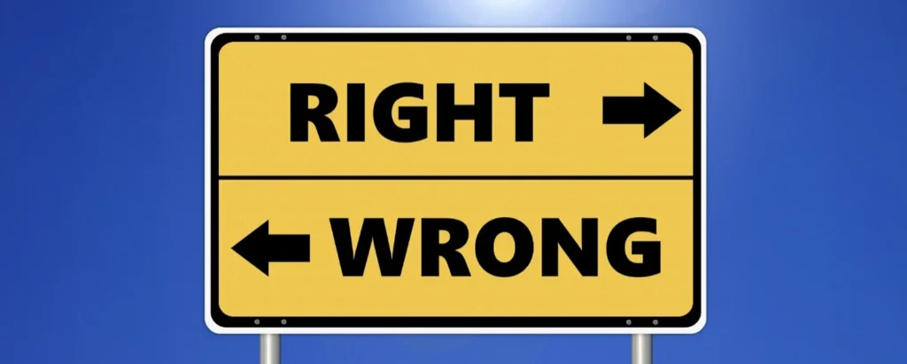Yellow road sign with arrows pointing to Right and Wrong